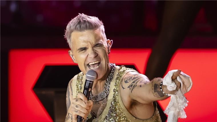 Diese Legenden stehen 2025 auf deutschen Bühnen Auch Popstar Robbie Williams kommt nach Deutschland. (Archivbild)