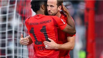 Bayerns Torschützen beim Jubel: Kingsley Coman (l) und Harry Kane.