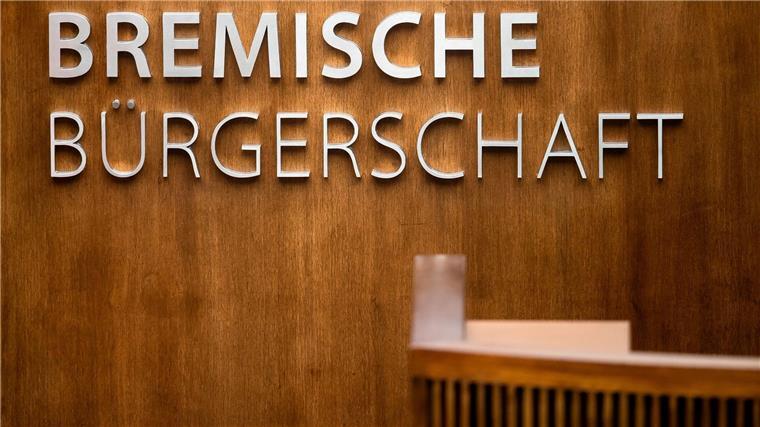 Bremische Bürgerschaft beschließt Nachtragshaushalt „Bremische Bürgerschaft“ steht über dem Rednerpult im Plenarsaal.