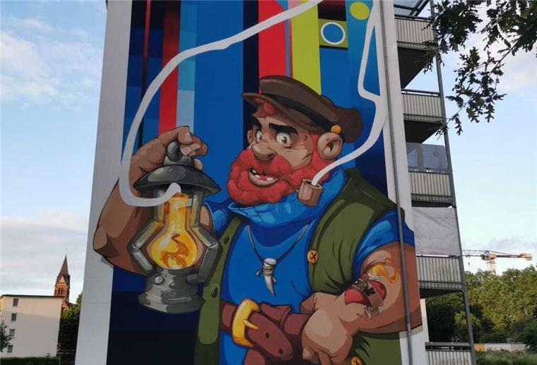 Street-Art in Bremerhaven: Was es mit dem neuen Kunstwerk auf sich hat Seemann mit Laterne als Wandbild im Comic-Stil
