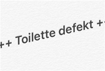 Aufschrift "Toilette defekt"