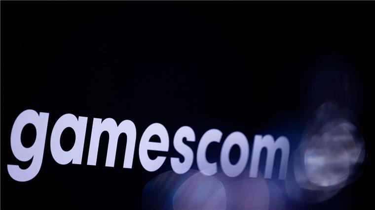 Ein Schriftzug der Gamescom prangt auf einem Schild einer Pressekonferenz.