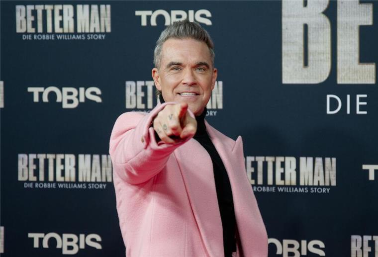 Wieso Konzerttickets immer teurer werden Kommt 2025 mit Konzerten nach Deutschland: Superstar Robbie Williams. (Archivbild)