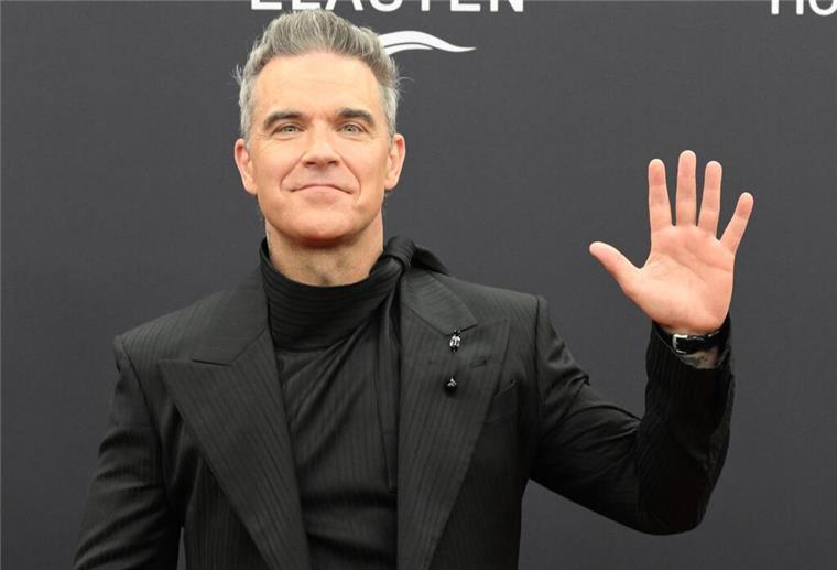 Robbie Williams singt neue FIFA-Hymne Robbie Williams hat als neuer Musikbotschafter der Fifa eine neue Hymne für den Weltfußballverband komponiert. (Archivfoto)