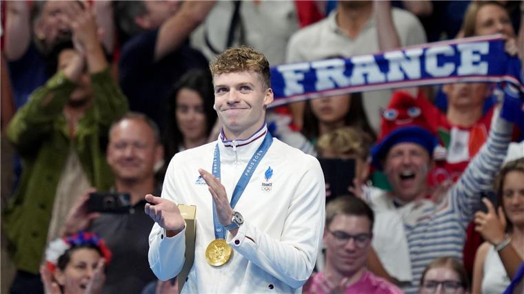 Trotz Wellbrocks Tief: Beste Schwimm-Bilanz seit 2008 Sorgte regelmäßig für Partystimmung: Frankreichs Schwimmstar Léon Marchand.
